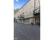 A multi-unit building with garages, air conditioning units and upper level walkout balconies at 6665 Boxcar Pl, Indianapolis, IN 46220