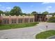 Exterior shot of a commercial building featuring a modern design, well-maintained landscaping, and ample parking at 6665 Boxcar Pl, Indianapolis, IN 46220