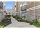 Beautiful exterior with stone accents, a small balcony, and a well-maintained walkway at 6665 Boxcar Pl, Indianapolis, IN 46220