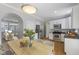 Open-concept kitchen featuring stainless steel appliances, granite countertops, and white cabinetry at 6665 Boxcar Pl, Indianapolis, IN 46220