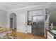 Bright modern kitchen with stainless steel appliances, light cabinets and hardwood floors at 6665 Boxcar Pl, Indianapolis, IN 46220