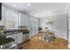 Bright kitchen and dining area with stainless steel appliances and view to the patio at 6665 Boxcar Pl, Indianapolis, IN 46220