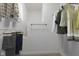 Spacious walk-in closet with ample storage, hanging racks, and shelves at 6665 Boxcar Pl, Indianapolis, IN 46220