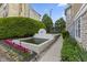 Relaxing water feature and lush landscaping offer a serene outdoor retreat with walking path at 6665 Boxcar Pl, Indianapolis, IN 46220