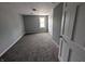 Bedroom showing neutral walls and carpeted flooring at 689 N Main St, Martinsville, IN 46151