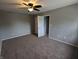 Bedroom featuring neutral walls, carpet, and ceiling fan at 689 N Main St, Martinsville, IN 46151