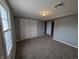 Bedroom showcasing neutral walls and carpeted flooring at 689 N Main St, Martinsville, IN 46151