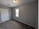 Bedroom featuring neutral walls and carpeted flooring at 689 N Main St, Martinsville, IN 46151