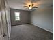 Bedroom featuring neutral walls, carpet, and ceiling fan at 689 N Main St, Martinsville, IN 46151