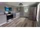 Modern kitchen with stainless steel appliances, gray cabinets and hardwood floors at 689 N Main St, Martinsville, IN 46151