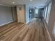 Open-concept living room with new flooring and a fresh, neutral paint palette at 689 N Main St, Martinsville, IN 46151