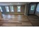 Open-concept living room with new flooring and a fresh, neutral paint palette at 689 N Main St, Martinsville, IN 46151