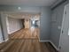 Open-concept living room with new flooring and a fresh, neutral paint palette at 689 N Main St, Martinsville, IN 46151