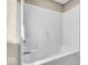 Clean and simple white bathtub and shower combination at 6916 Ralph Ct, Indianapolis, IN 46220