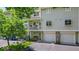 Exterior view of home, featuring a balcony, attached garage, and well-maintained landscaping at 6916 Ralph Ct, Indianapolis, IN 46220