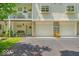 Inviting exterior showcasing a balcony, stone accents, and attached garages at 6916 Ralph Ct, Indianapolis, IN 46220