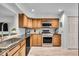 Well-equipped kitchen featuring stainless steel appliances, granite countertops, and ample cabinet space at 6916 Ralph Ct, Indianapolis, IN 46220