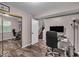 Efficient home office setup with a full wall mirror, desk and staircase access to another level at 6916 Ralph Ct, Indianapolis, IN 46220