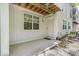 Relaxing outdoor patio area with concrete floor and building access at 6916 Ralph Ct, Indianapolis, IN 46220