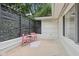 Back patio includes privacy screening, string lights, and outdoor seating at 7277 N College Ave, Indianapolis, IN 46240