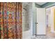 Bathroom features a tub with shower, colorful shower curtain, and stylish fixtures at 7277 N College Ave, Indianapolis, IN 46240