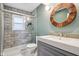 Bathroom featuring a shower with glass door, modern toilet and grey vanity at 7277 N College Ave, Indianapolis, IN 46240