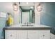 Modern bathroom vanity with stylish lighting and a decorative mirror at 7277 N College Ave, Indianapolis, IN 46240