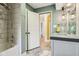 Bathroom features updated vanity, modern lighting, and shower-over-tub at 7277 N College Ave, Indianapolis, IN 46240
