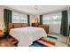 Bedroom featuring hardwood floors, natural light and neutral walls at 7277 N College Ave, Indianapolis, IN 46240