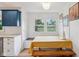 Bright breakfast nook with paneled walls, a view, and proximity to the updated kitchen at 7277 N College Ave, Indianapolis, IN 46240