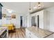 Bright, updated kitchen offers an island, shaker cabinets and stainless steel refrigerator at 7277 N College Ave, Indianapolis, IN 46240