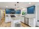 This updated kitchen features shaker cabinets, granite counters, subway tile backsplash and stainless appliances at 7277 N College Ave, Indianapolis, IN 46240