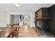 The open-concept living space has a fireplace and opens into the kitchen with blue cabinets at 7277 N College Ave, Indianapolis, IN 46240