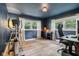 Home office or exercise room with hardwood flooring and natural light at 7277 N College Ave, Indianapolis, IN 46240
