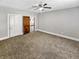 Bedroom featuring carpet, ceiling fan, and natural light from two windows at 734 W North St, Lebanon, IN 46052