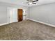 Bedroom featuring carpet, ceiling fan, and natural light from two windows at 734 W North St, Lebanon, IN 46052