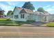 Charming exterior of home with green siding and view of the street at 734 W North St, Lebanon, IN 46052