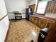 Kitchen with wood cabinets, laminate counters, gas range, and black refrigerator at 734 W North St, Lebanon, IN 46052