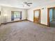 Large living room featuring classic trim, carpeted floors, and natural light at 734 W North St, Lebanon, IN 46052