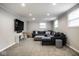Spacious basement featuring recessed lighting, plush carpeting, and a comfortable sectional sofa at 7531 Mohawk Ln, Indianapolis, IN 46260
