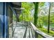 Spacious balcony with panoramic views of the lake and surrounding trees at 7753 Ivy Dr, Nineveh, IN 46164