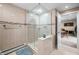 Elegant bathroom featuring a walk-in glass shower with tan tile and seamless entry to the dining room at 7753 Ivy Dr, Nineveh, IN 46164