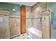 Clean bathroom featuring tiled floors, a wooden cabinet and a glass enclosed shower and tub at 7753 Ivy Dr, Nineveh, IN 46164
