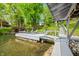 Lakeside dock with lounge chairs provides a perfect relaxation spot by the calm water and scenic views at 7753 Ivy Dr, Nineveh, IN 46164