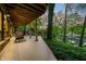Enjoy lake views from this covered patio with comfortable seating at 7753 Ivy Dr, Nineveh, IN 46164