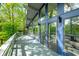The back of this home has a long deck and is made of walls of windows to let in natural light at 7753 Ivy Dr, Nineveh, IN 46164