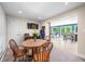 Charming dining room with a wood table, seating for four, and seamless transition to the living area at 7753 Ivy Dr, Nineveh, IN 46164