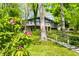 Charming home nestled amongst the trees and lush greenery at 7753 Ivy Dr, Nineveh, IN 46164