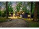 Scenic home with a beautiful blue exterior surrounded by mature trees and a winding driveway at 7753 Ivy Dr, Nineveh, IN 46164