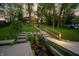 Picturesque landscaping with a stone waterfall feature leads to a lakeside retreat at 7753 Ivy Dr, Nineveh, IN 46164